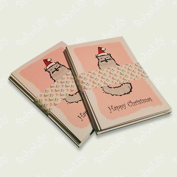 The Tatty Cat character is born out of an embroidery gone wrong & features in these Christmas cards for the alternative cat-obsessed celebrator of Christmas. Each pack contains four different designs on smooth matt 300gsm card, with white envelopes. Blank inside.