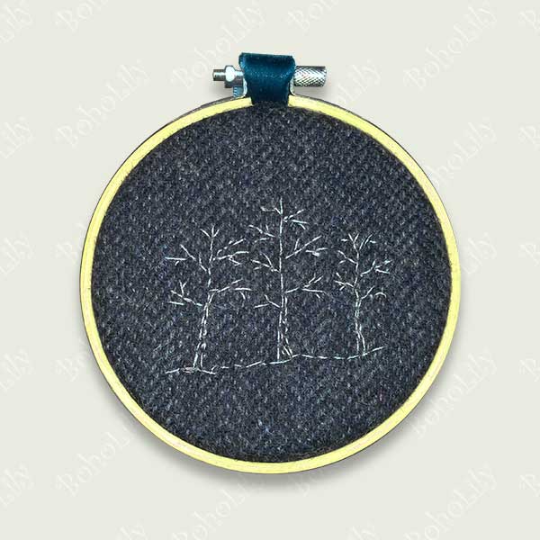 One of the ‘Tweed’ collection. Three silver winter trees stitched onto dark blue Harris tweed fabric.  Supplied with teal velvet ribbon hoop ready for hanging. One available.