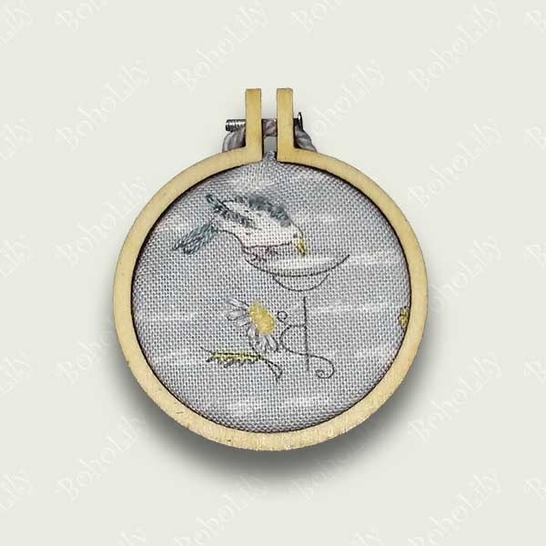 This is an embroidered bird and daisy onto a pre printed fabric.  It comes with a contrasting cotton yarn loop ready to hang and is supplied in a pretty handmade gift box.  Only one is available.