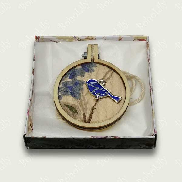 This is a blue bird charm hand stitched with DMC metallic thread on to a recycled fabric background. It comes supplied with a cotton yarn hanging loop and is presented in a pretty handmade gift box making this a delightful one-off gift.  Only one is available.