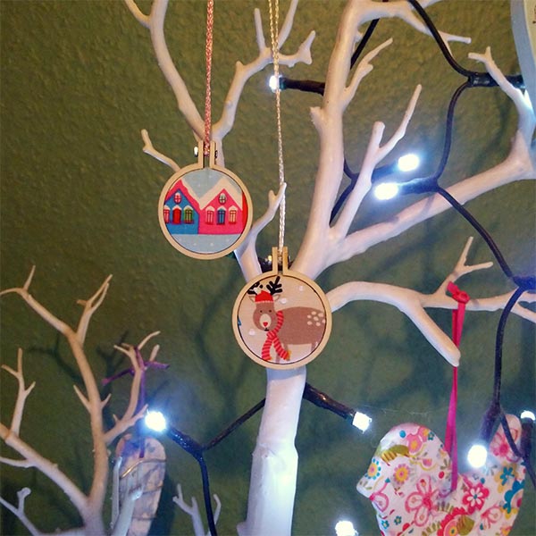 A pair of cute mini hoops in an even cuter hand-made Santa sack.