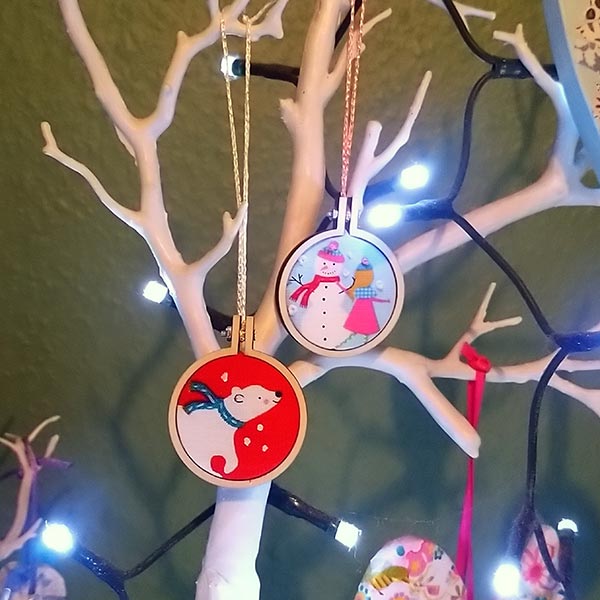 A pair of cute mini hoops in an even cuter hand-made Santa sack.