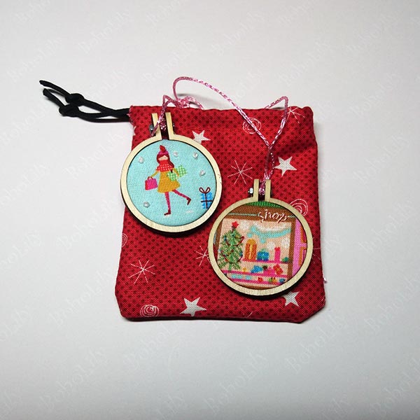 A pair of cute mini hoops in an even cuter hand-made Santa sack.