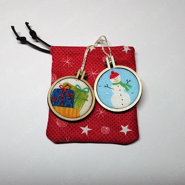 A pair of cute mini hoops in an even cuter hand-made Santa sack.