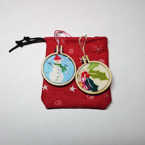 A pair of cute mini hoops in an even cuter hand-made Santa sack.