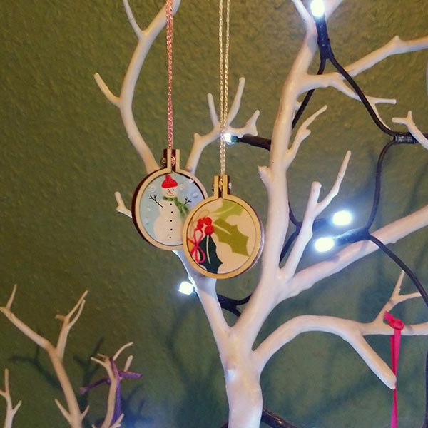 A pair of cute mini hoops in an even cuter hand-made Santa sack.