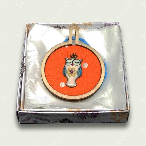 This is an owl charm hand stitched using DMC metallic thread onto an orange polka dot fabric.  It comes supplied with a contrasting cotton yarn loop ready for hanging and is supplied in a pretty handmade gift box. This colourful piece would make a great gift. Only one available.