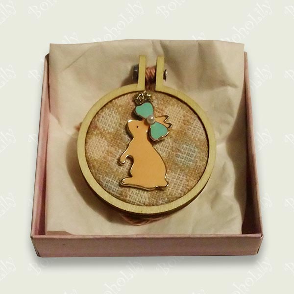 A cute pink hare charm stitched onto  contrasting recycled fabric. Supplied with cotton yarn hanging loop and pretty handmade gift box.