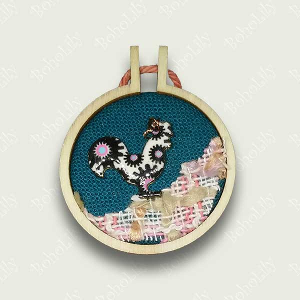 This quirky cockerel charm has been hand stitched using DMC metallic thread onto a dark teal fabric background with a recycled appliqued foreground. It is ready to hang with the contrasting cotton yarn.  This item is supplied in a beautiful handmade gift box making it an ideal and unique present. Only one available 