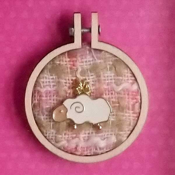 Sheep charm stitched onto recycled fabric using DMC metallic thread in mini embroidery hoop. Mounted onto pink background and framed in a shadow box frame. Freestanding or wall hanging  Only one available.